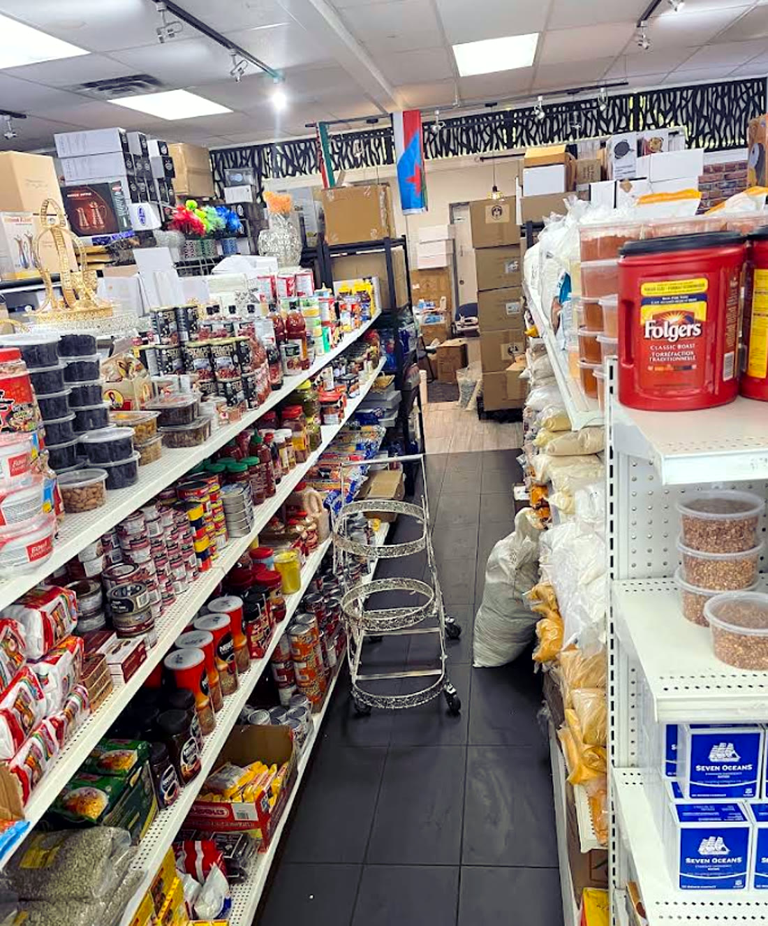 Stocked grocery shelves inside East Africa Store